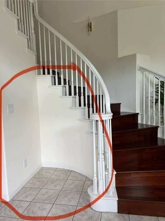 Creative Ways to Style the Space Under a Curved Staircase