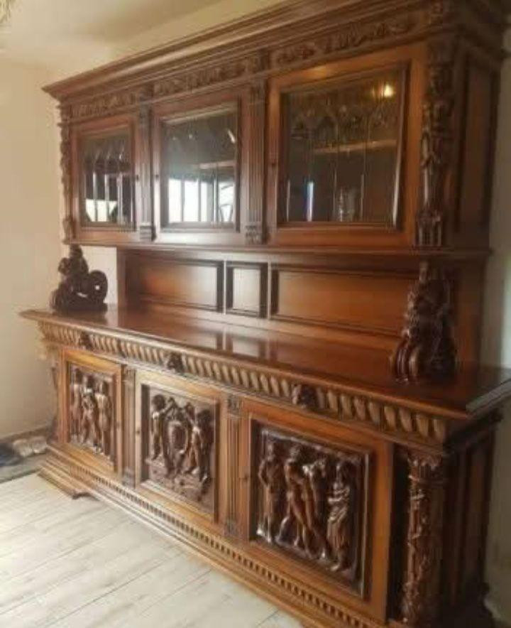 My husband and I got this dresser hutch recently and I want to paint it red. Hubby says no way….