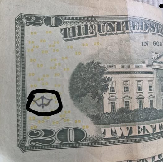 Why a Bow and Arrow Symbol Appears in Certain US Currency Designs